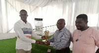 Owusu (L) receiving his trophy from Nana Dei Broni