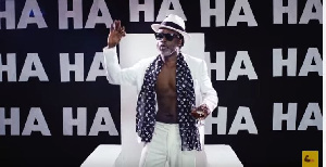 Reggie Rockstone in a scene in the video