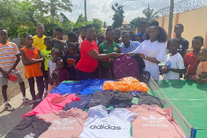 Rhoda (in white) making the presentation to the Asoba Table Tennis Foundation