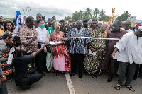 Bawumia cutting a ribbon to open the Jasikan-Dodo Pepesu road project