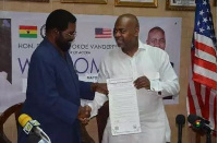 Dr Vanderpuije and Mr Baraka exchanging the MOU