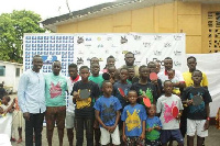 Lartey with some of the children who participated in the table tennis fair