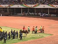 A personnel from the prison's service being carried off by First Aid officers