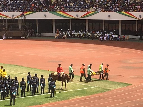 A personnel from the prison's service being carried off by First Aid officers