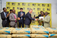 MD of Ghacem, Morten Gade (left) presenting the letter of donation to the Medical Director [right]