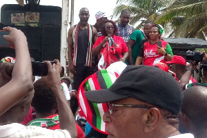 MP Dzifa Gomashie (with mic) addresses people after health walk in Aflao