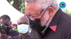 Former President Jerry John Rawlings in a solemn mood at his mother's funeral