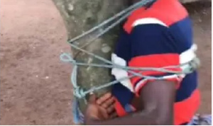 Boy Tied To A Tree