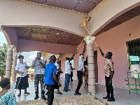 Members of the union engage in a clean-up exercise to mark the celebration