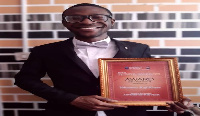 Yohanness Awunyo Kofi Kuvor with his award