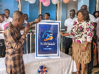 Dr. Abena Tay (right) unveiling the anniversary logo