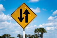 The two-way intersection sign helps caution drivers entering from one-way roads