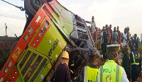 A photo of the somersaulted Neoplan bus