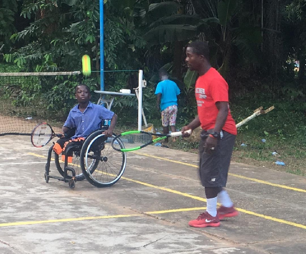 Promising Wheelchair tennis star, Zachariah with coach Yahya