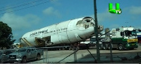 The plane preparing to be towed away