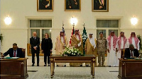 Representatives of Sudan's army and the paramilitary Rapid Support Forces (RSF) signing an agreement