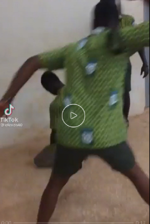 A senior mercilessly lashing a junior with a belt