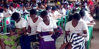 Graduates filling their acceptance form to become Camfed members