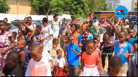 Some Christian children marching with their palm fronds on Palm Sunday morning