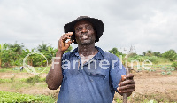 A happy farmer who works with Farmline Limited