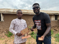 Nana Tea with the Godfred Nyarko, who build computers from cardboard