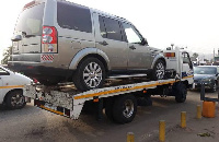 The broken down vehicle being towed away for maintenance