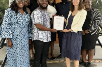 Recepient Eric Asamoah Awuah receives award from British High Commissioner Harriet Thompson