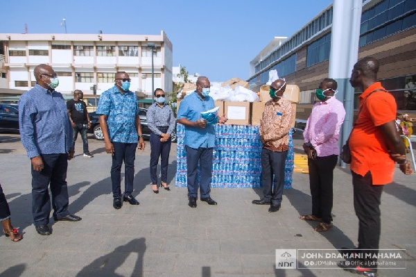 Former President John Mahama and some members of the NDC's COVID-19 Response team making a donation