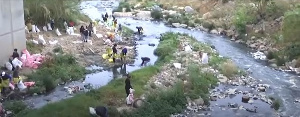 Some residentsof Alexandra, Johannesburg cleaning the banks of the Jukskei river