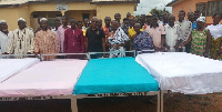 Nana Atta Foster Owusu III with elders and CHPS workers