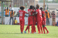 Asante Kotoko players celebrating with the Isaac Oppong