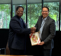 Professor Tony Travaglione, the Interim Deputy Vice-Chancellor with H.E Dr.  Joseph Agoe