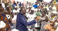 Otumfuo Osei Tutu II dancing with his subject at the Manyhia Palace after his arrival form Trinidad