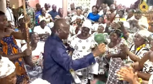 Otumfuo Osei Tutu II dancing with his subject at the Manyhia Palace after his arrival form Trinidad