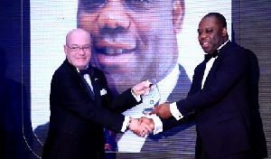 Dr. Matthew Opoku Prempeh, Education Minister receiving his award from US Ambassador Robert Jackson