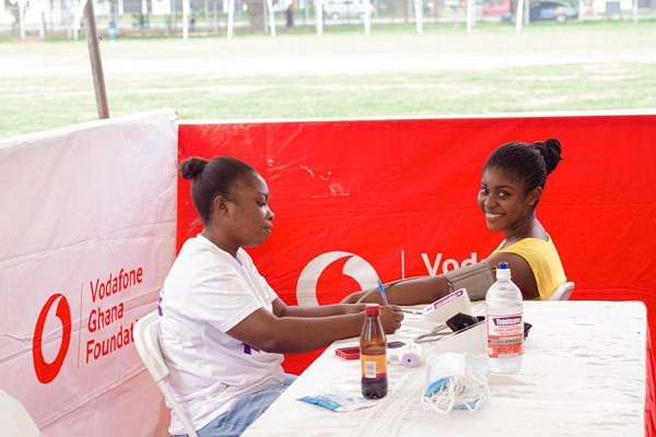 A student getting her vitals checked