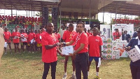 Samuel Tettra receiving his award