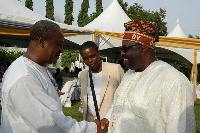 President John Dramani Mahama and Nigerian politician Chief Momodu Dele shake hands