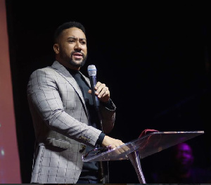 Majid mounting a stage and preaching the gospel