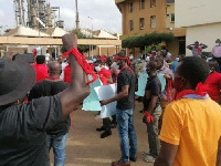 Some of the workers clad in red t-shirts and armbands