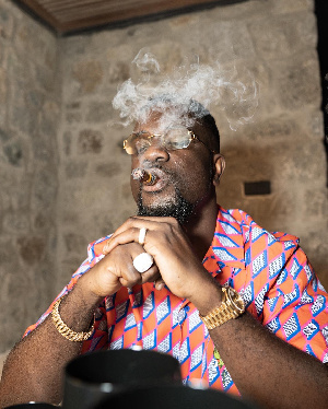 Sarkodie smoking a cigar