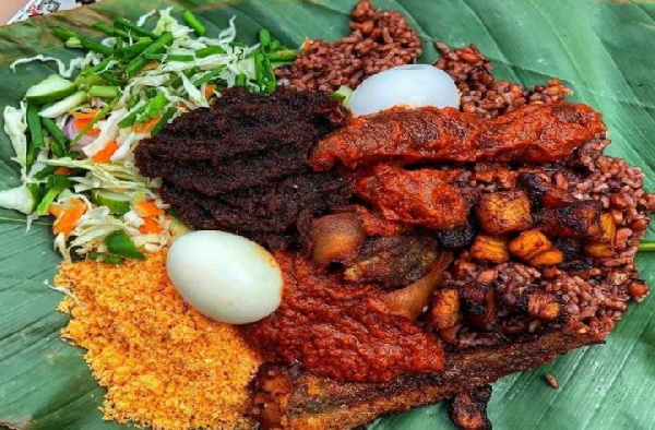 Waakye served in plantain leaves