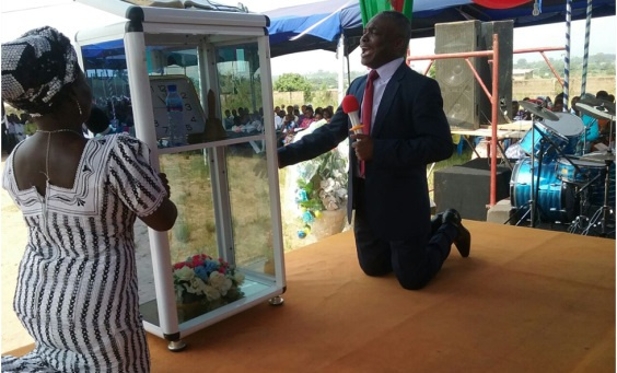 Apostle Joseph Assabil (right) delivering the sermon