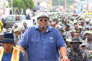 Henry Quartey with 'Operation Clean Your Frontage' personnel