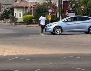 Man knocked down while trying to stop a car