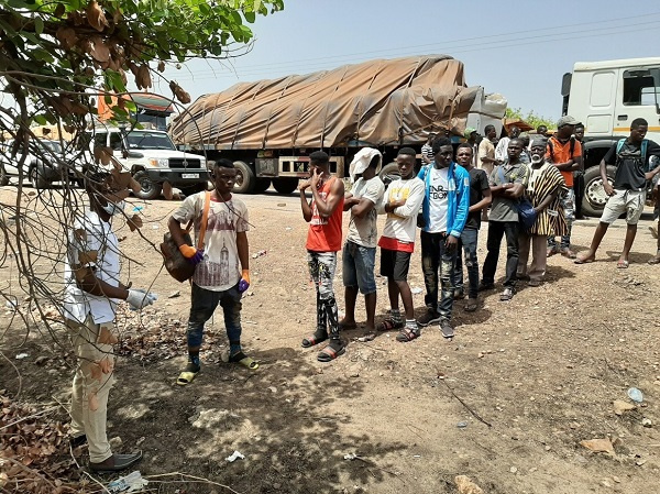 Some passengers waiting to be screened