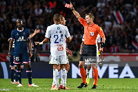 Willy Delajod shows a red card to Alexander Djiku [Photo by Baptiste Fernandez/Icon Sport via Getty]