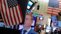 A trader works on the trading floor at the New York Stock Exchange in New York City