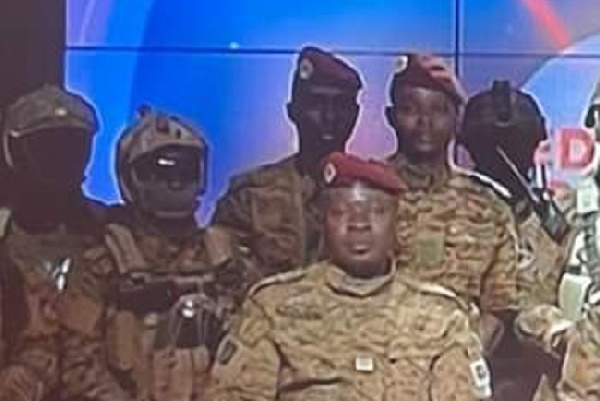 Lt. Col. Paul-Henri Sandaogo Damiba (seated) during announcement of the coup