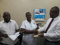 Deputy Sports Minister Pius Enam Hadzide [right]  at the hospital